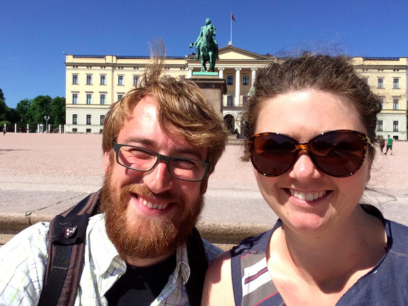 Appreciating the sun and palace in Oslo