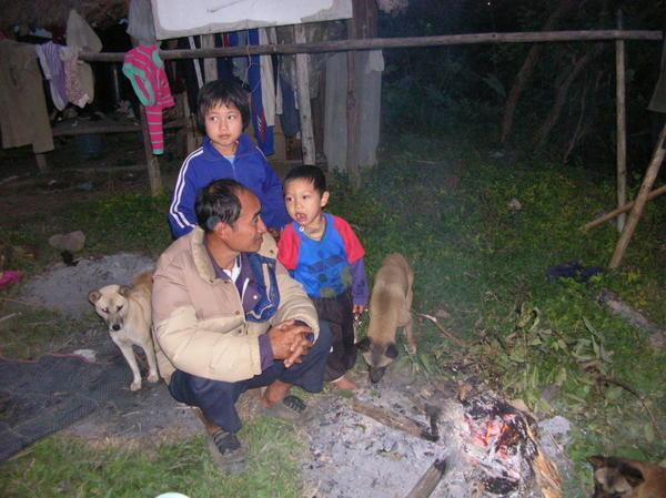 a father and his sons hanging at the fire