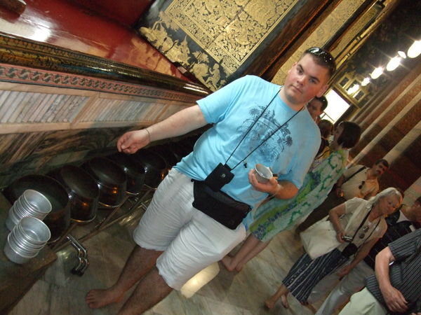 Guy doing his coins - Reclining Buddha