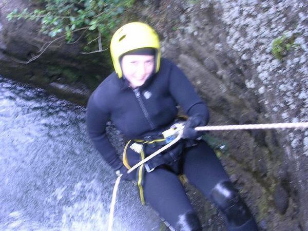 Jo abseiling down the waterfall - photo one