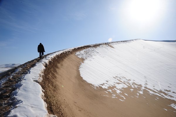 Chris J Stanley hikes up a sand dune... for the greater good