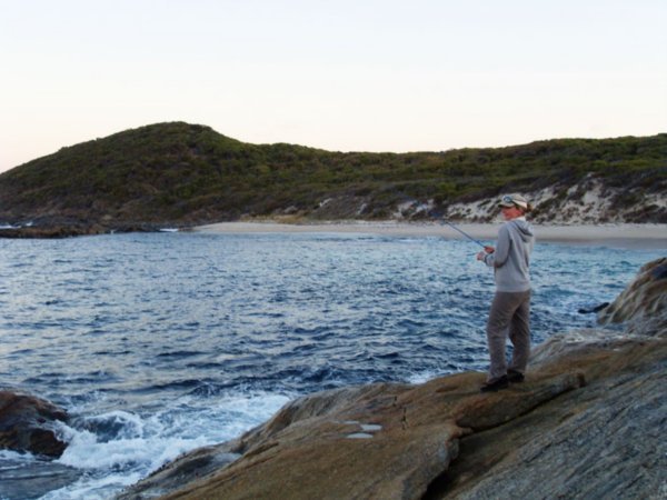 Janine fishing off the rocks