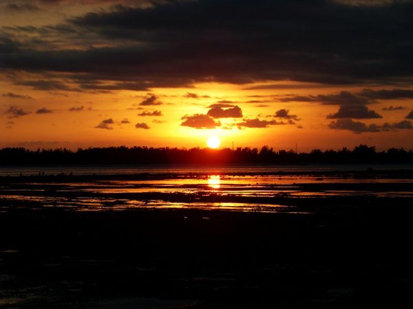 Sunset over the seagrass at low tide on Gili Air