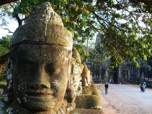 Janine walking along the bridge into Angkor Thom