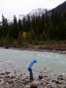 Pippi Attempting to Wash the Paint Off Her Shoes and Pants in the River