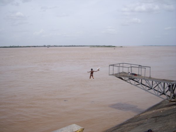 Boys jumping into the Mekong