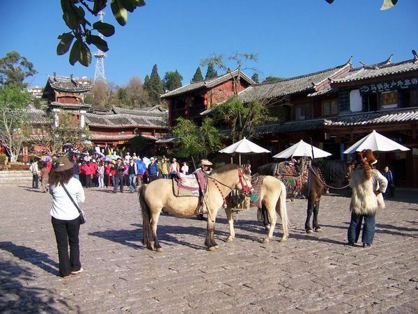 Tourist Group Arriving in Town Square