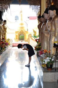 Girl worshipping all buddhas individually