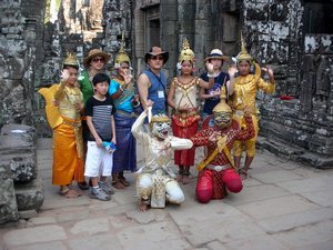 Koreans posing with unhappy Cambodians