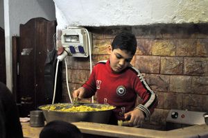 Boy making falafel