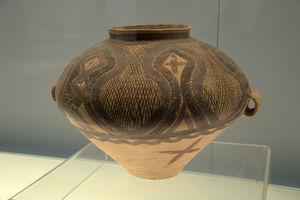 Painted pottery pot with geometric lattice pattern