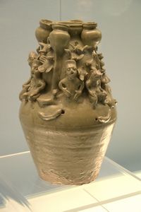 Celadon jar with modeled human figurines