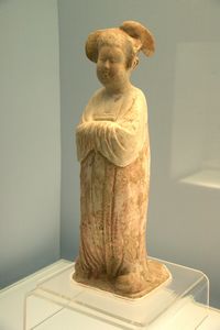 Coloured pottery female figurine