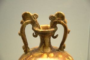 Polychrome-glazed pottery Zun (pot) with two dragon-headed heandles
