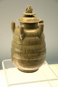 Celadon five-tube jar and cover with carved design of lotus petals