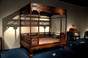 Six-post canopy bed with front railings