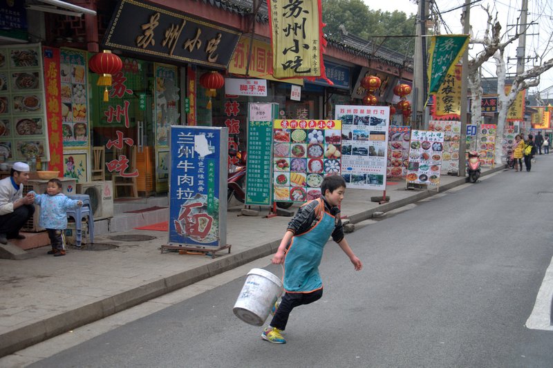 Chinese Muslim kid in food street