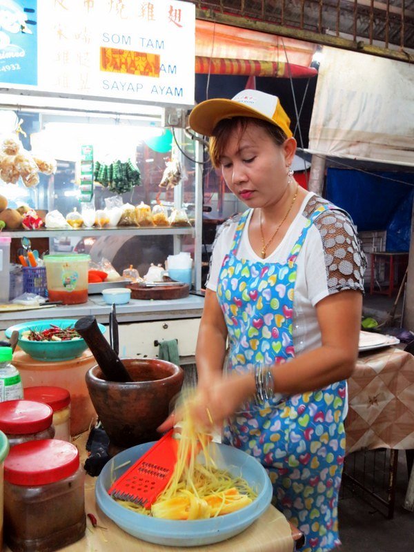 Thai lady preparing som tam