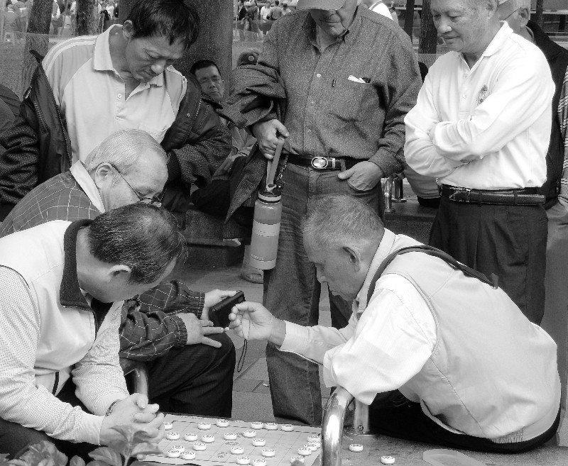 Oldtimers playing a type of chess