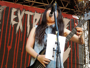 That creepy little girl from all those Japanese horror films on bass