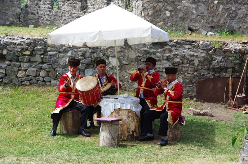 Traditional band before palace fortress walls
