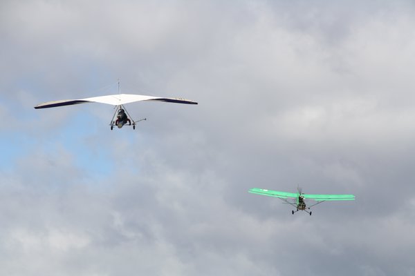 Hang glider being towed by the plane