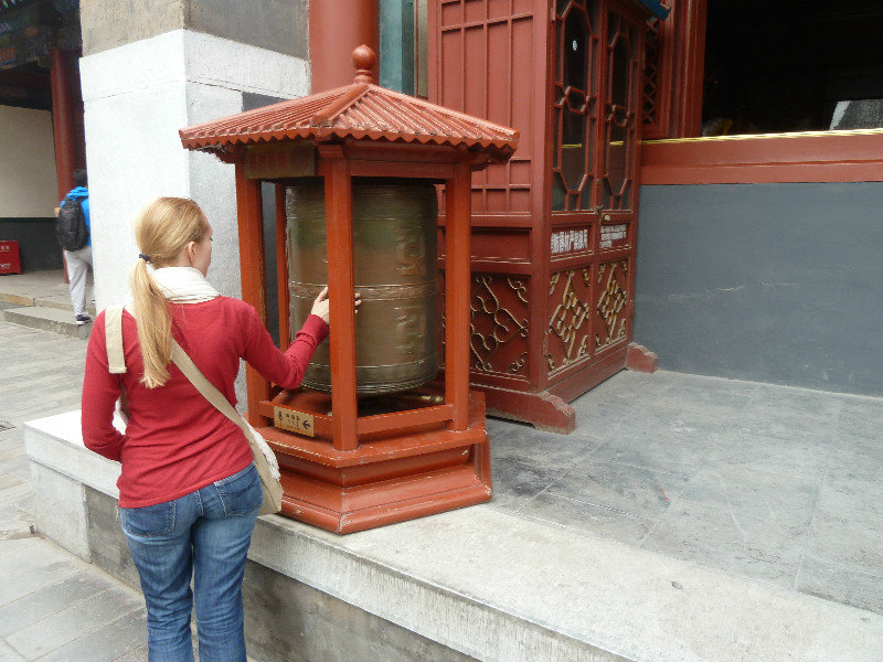 Jennifer and one of the many prayer wheels at the Lama Temple