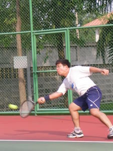 Father Cherdchai playing tennis