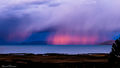 Sunset reflecting off the rain over Lake Titicaca