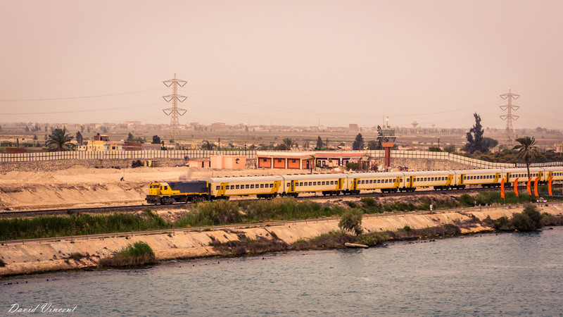 Train running along the Suez Canal