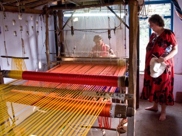Kim watching silk weaving