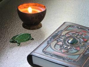 Meditating with candle and turtle