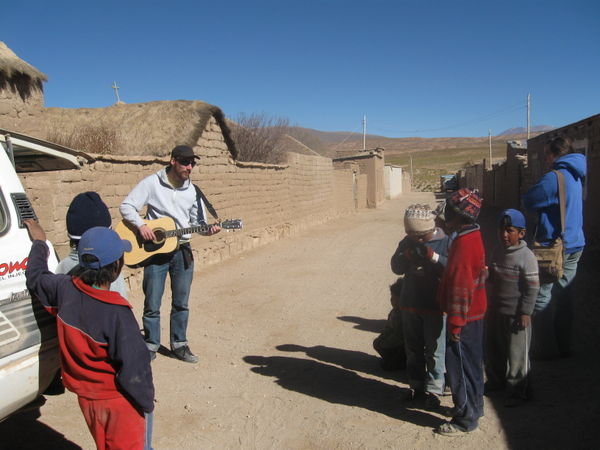 One of the guys playing his guitar for the Bolivian children in a small village we stopped at for lunch
