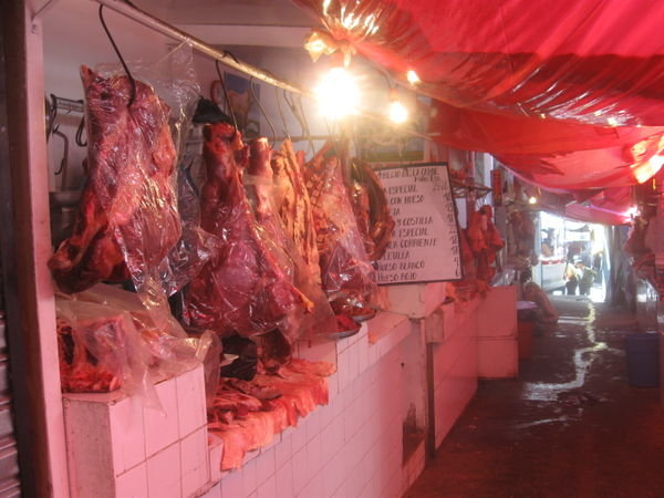 The luke warm meat hanging up at the market!