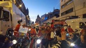 Hundreds of Santas on motorbikes
