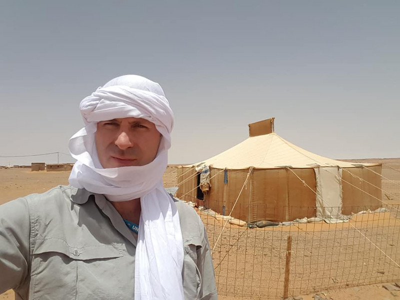 In the middle of the Sahara Desert, dressed ready for sand storms