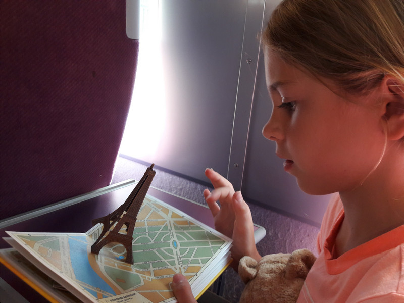 On the train home, enjoying our new pop up book