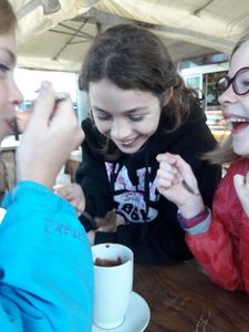 Kids enjoying a hot chocolate, Italian style, very sweet and thick