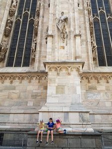 Milan cathedral, 3 exhausted children