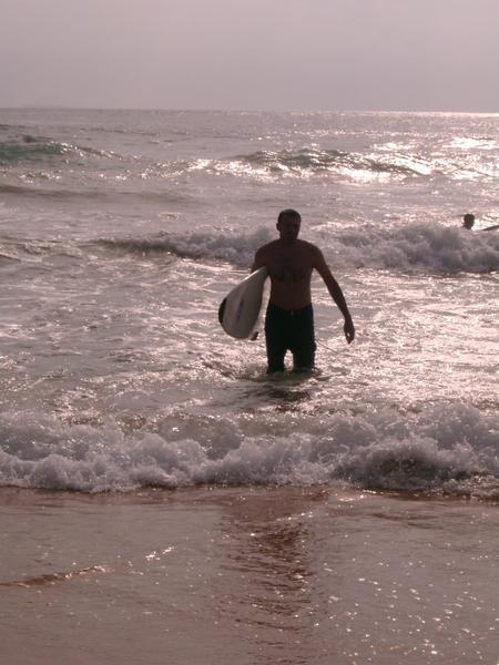 Murray emerging from the waves after a hard day surfing at Hikkaduwa.