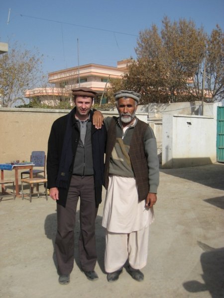 Murray in his Afghan hat with one of the local staff