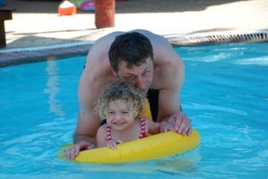 Charlotte enjoying the water with Dad