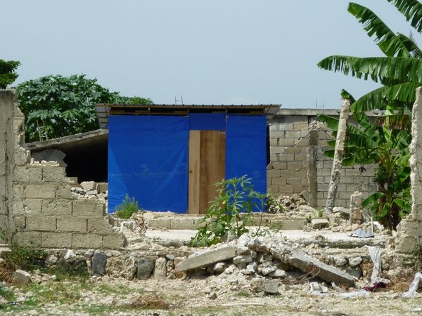 Transitional shelter constructed at site of collapsed house