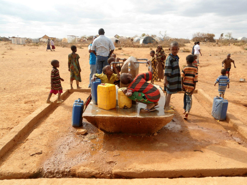 Kids drinking from the water collection point, Dollo Ado