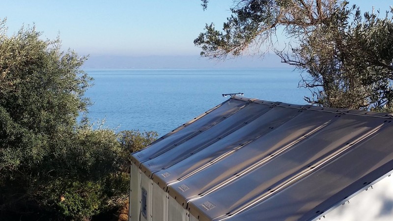 I'd recommend Refugee Housing Unit 152, it has the best sea view. You can see the Turkish coast in the distance.