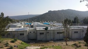 Accommodation block with solar hot water heaters for showers at Moria.