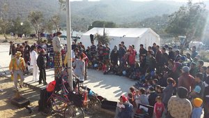 Clowns without borders entertaining children and adults while they wait for registration at Moria.