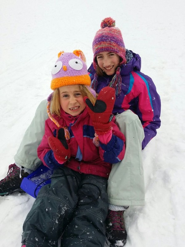 Emily and Hayley sledging