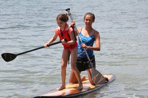 Ariana and Char trying paddle boarding