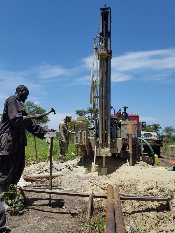 Drilling boreholes to provide water for new refugee settlement in Uganda
